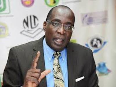 Ruel Reid charged with corruption; spends night in the slammer